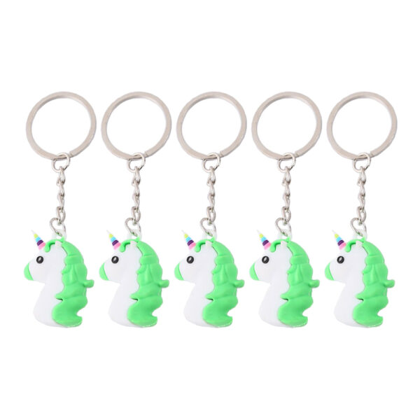 a group of keychains with green unicorns